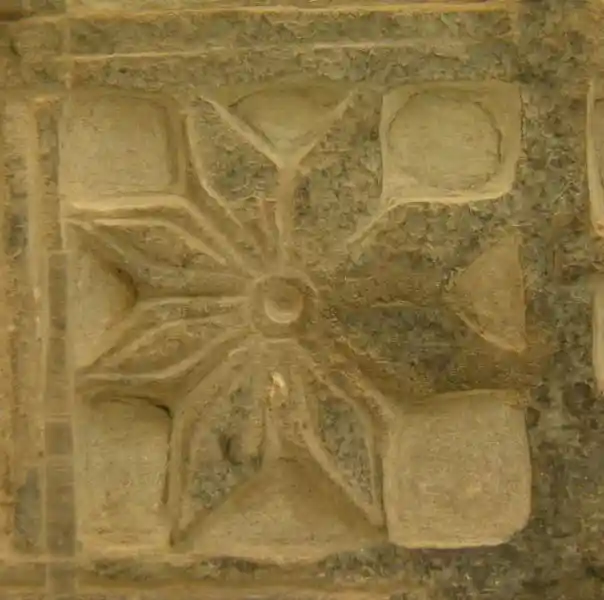 Eight-point rosette solar disc inside a square